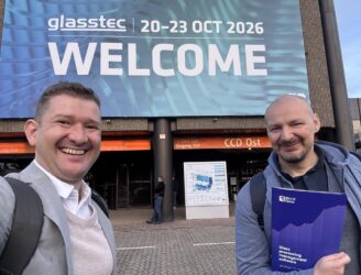 MonitGlass team in front of the glasstec 2026 entrance in Düsseldorf