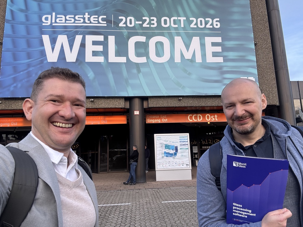 MonitGlass team in front of the glasstec 2026 entrance in Düsseldorf